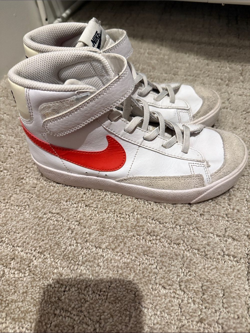 Nike Kids White High-Top Sneakers with Red Swoosh